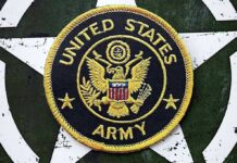 United States Army embroidered patch on a green star background