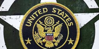 United States Army embroidered patch on a green star background