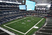 Air Force Rappelling Demo Ends Tragically American football stadium interior with large central video board