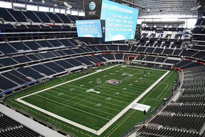 American football stadium interior with large central video board