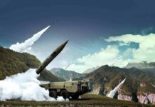 Mid-Flight Flip Stuns Army Test mobile missile launcher firing in mountain landscape